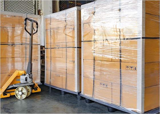 Pallets in a warehouse wrapped in plastic.