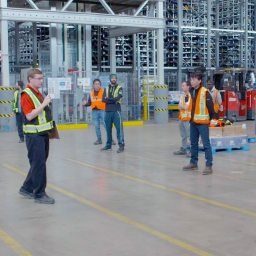 In this image, a group of people working together.